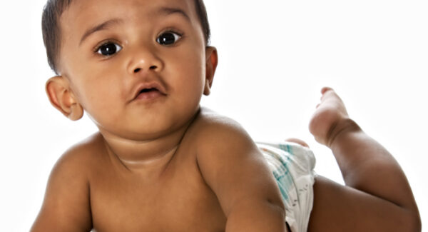 Happy infant after overcoming tongue tie and feeding difficulties
